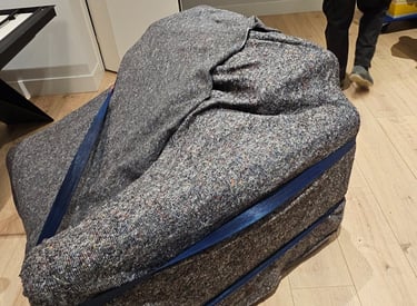 a man walking through a room with a suitcase