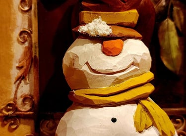 hand carved snowman with tophate and scarf, carved in basswood by James Smith