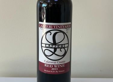 A close up picture of a wine bottle labeled 2015 Red Wine