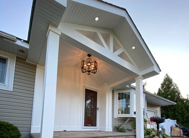 a house with a porch and a light fixture