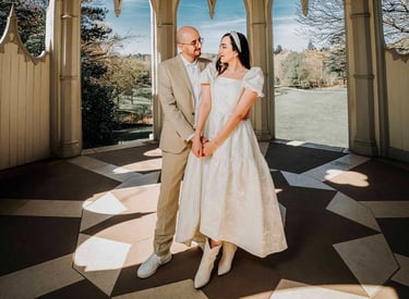 Couple holding hands inside an ornate pavilion in Park, captured by Fred Art Studio.