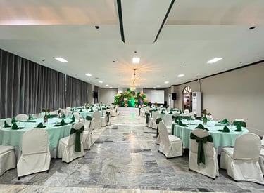 a event ballroom with tables and chairs and a chandelier