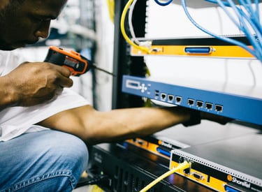 a man in a white shirt is holding a drillet