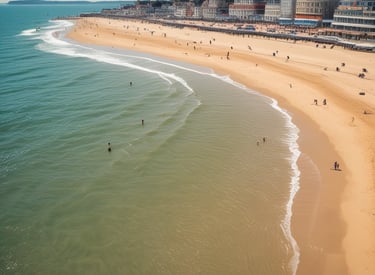 A bright, sunny photo capturing the natural limestone arch of Durdle Door with clear blue skies and turquoise sea.