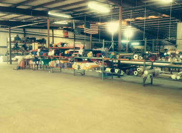 tote bag fabric nterior of a textile manufacturing facility with rolls of American-made fabric