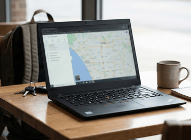 Laptop showing property management workflow with secure cloud access and staff sign-in protection