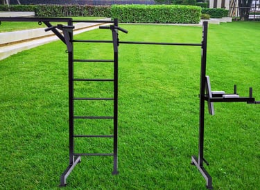 Outdoor pull-up bar station and calisthenics equipment on a lush green lawn for backyard bodyweight workouts.