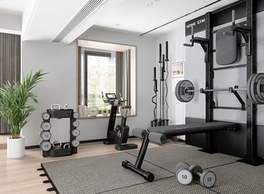 Home gym with bench, barbell, dumbbells, and kettlebells in a bright room with large windows