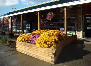 outdoor flower box in front of large porch