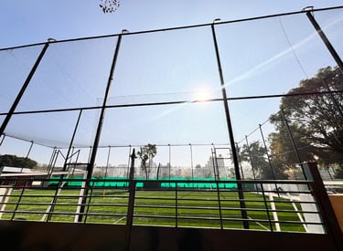 A football field surrounded by secure, high-quality nets to keep the ball in play.
