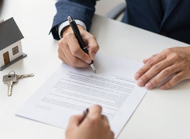A professional notary carefully reviewing loan documents at a sleek desk.
