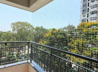 Close-up of durable netting material stretched tightly over a window frame.
