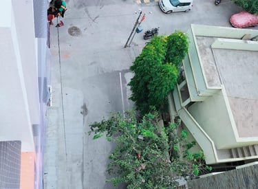 Technician from Arjillo Enterprises installing a duct area net in Whitefield, Bangalore.