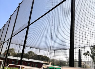 Close-up of strong football nets stretched across a field.