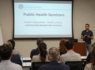 A public health seminar with a speaker engaging the audience.