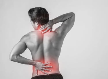 Person holding neck and lower back with red highlights showing pain and discomfort in spine area