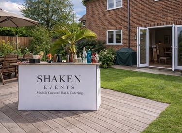 Shaken Events mobile cocktail bar and catering setup on a backyard patio for a private garden party.