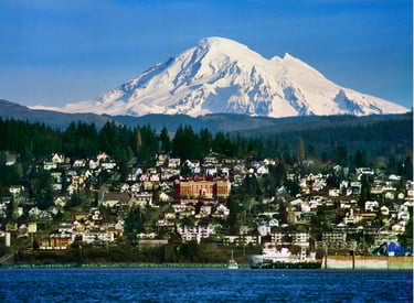 Scenic view of Bellingham, Washington with Mount Baker towering over the city and harbor.