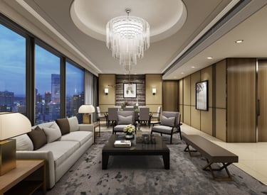 Luxury modern living room with a crystal chandelier, grey sofa, and city skyline view through large windows.