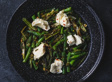 A plate of grilled scallion, green bean and mozzarella salad. Recipe by Dan Clapson