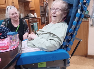 happy smiling older woman with happy caregiver daughter