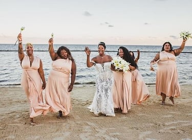 a bride and groomsmid are posing for a photo