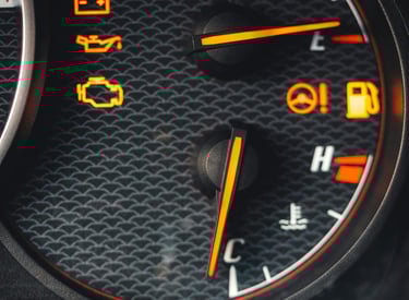 Car dashboard with multiple warning lights on, including the check engine light, indicating dpf egr