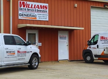Williams electric services & generators office and warehouse with two service vehicles in front 