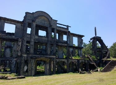 a large building with a staircase leading up to a staircase