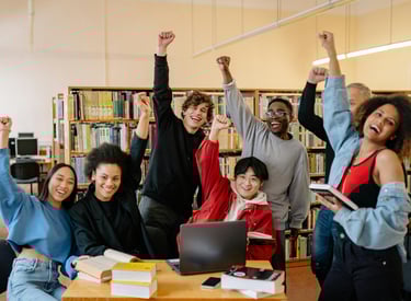 group-of-students-raising-their-hands-for-success