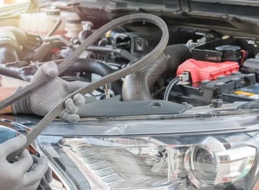 a man working on a car with a wrench