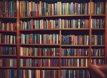 A small, round robot with a smooth white surface and blue accents operates a blue laptop on a sleek, floating platform. The robot has glowing eyes and an antenna on its head, with an 'AI' emblem on its front.
