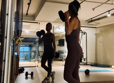 a woman in a gym suit is doing a boxing exercise