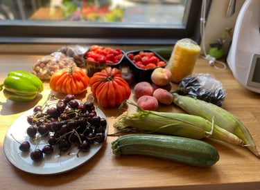 a table with a bunch of fruits and vegetables