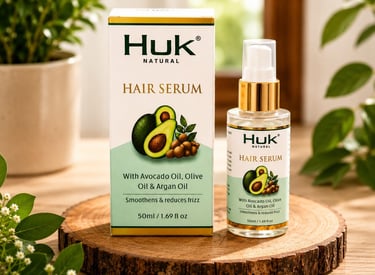 Huk Natural hair serum bottle and box with avocado oil, olive oil, and argan oil for frizz reduction.