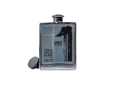 a bottle of uno tequila cristalino - premium tequila cristalino