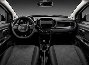 Interior do Fiat Mobi Like 2026 com painel, volante e cabine em visão frontal ampla.