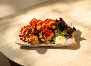 Crispy Japanese chicken karaage drizzled with spicy red sauce, served with fresh lettuce and mayo.