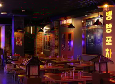 a korean restaurant with a large table and chairs