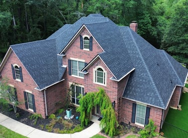 Final photo of a residential roof replacement in Tyler, TX using IKO Roofing Granite Black shingles