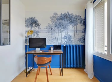 a desk with a computer and a chair