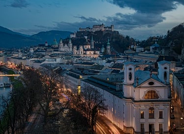 a cityscape of a castle with a castle in the background - JS Slachta Limousine Service