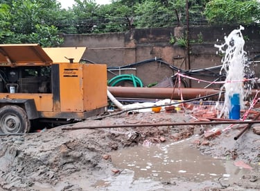 a truck with a hose attached to a pipe