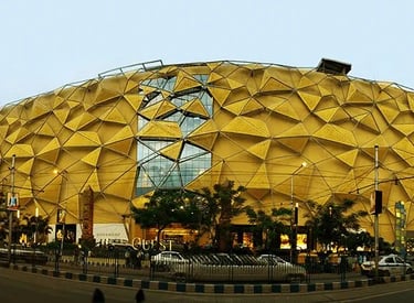 a large yellow building with a large yellow dome