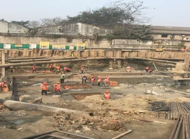 a group of people standing around a construction site