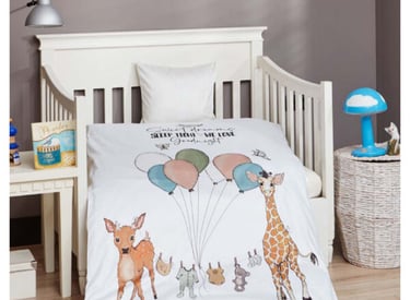 a baby's bed with a baby's bedding and a baby '