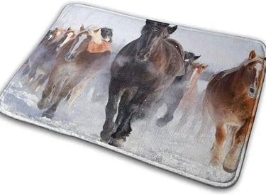 a herd of horses running in the snow