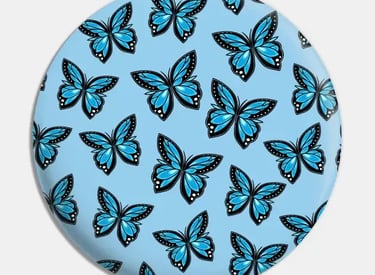 a blue and white plate with a blue butterfly