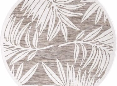 a round rug with a palm tree in the middle