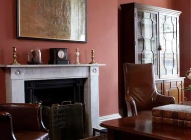 a living room with a couch and a fireplace